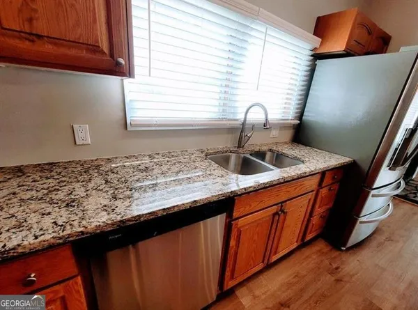 a stove top oven sitting inside of a kitchen