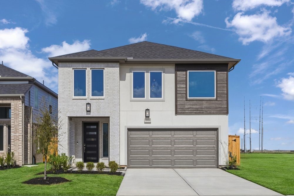 22122 Rangemore Drive Cypress, TX 77433 - Photo 1 of 28 a front view of a house with a yard
