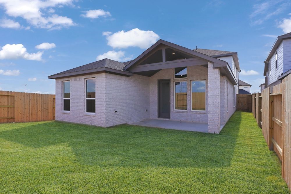 22122 Rangemore Drive Cypress, TX 77433 - Photo 15 of 28 a front view of a house with a yard and garage