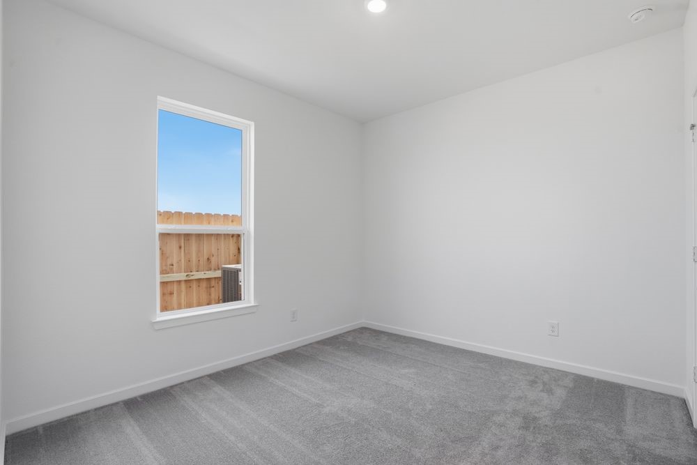 22122 Rangemore Drive Cypress, TX 77433 - Photo 9 of 28 an empty room with a window