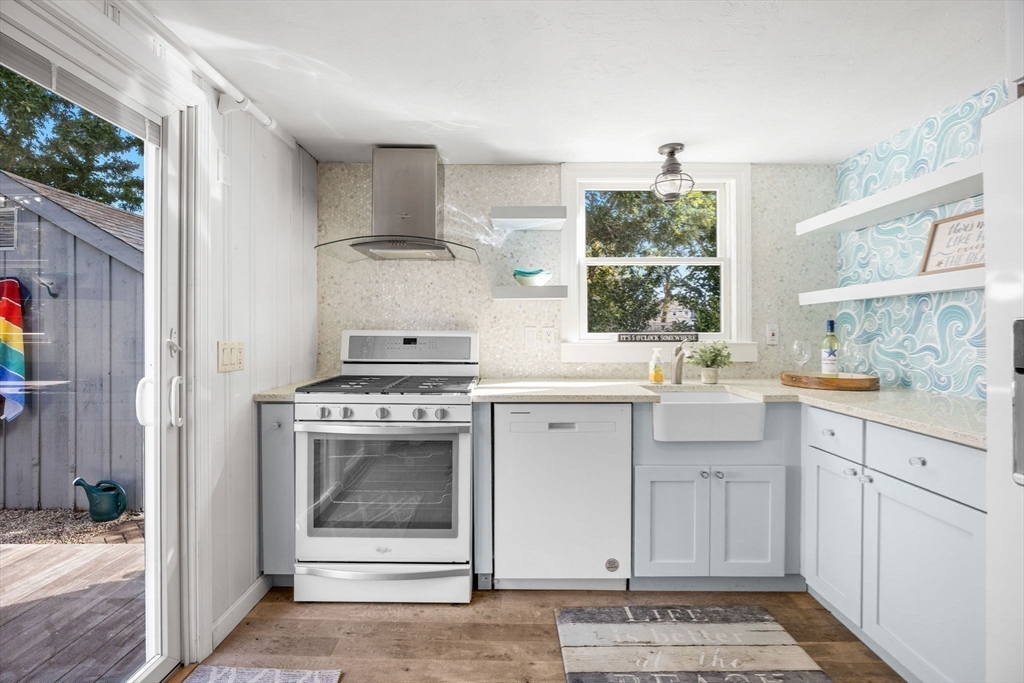 23 Zylpha Road Harwich, MA 02646 - Photo 11 of 39 a kitchen with cabinets appliances and a window