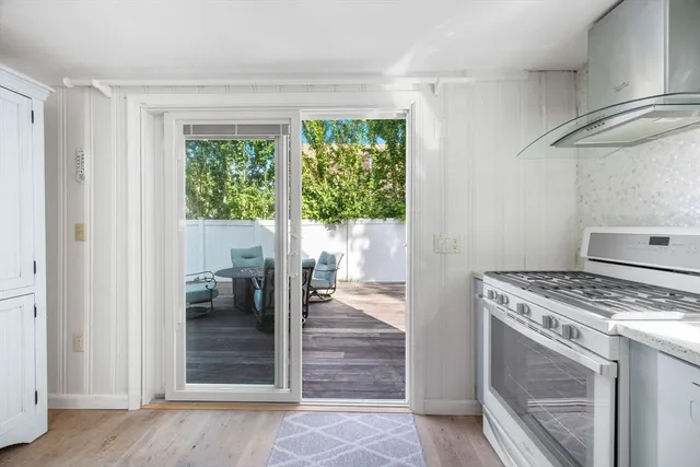 a kitchen with a stove and a refrigerator