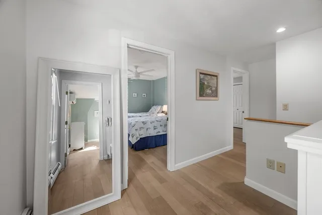 a view of bedroom with wooden floor