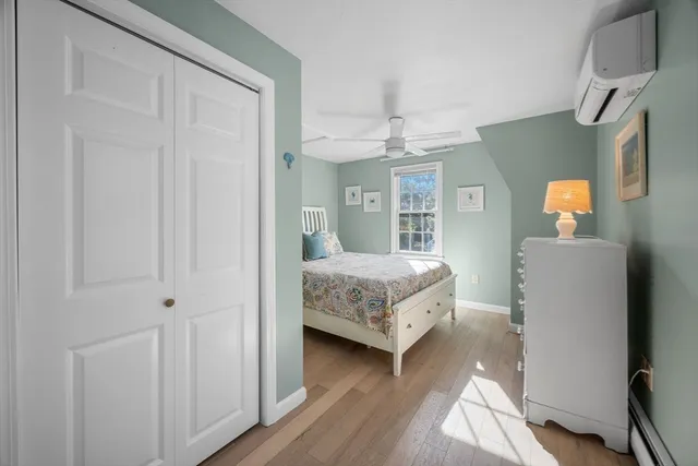 a bedroom with a bed and a mirror