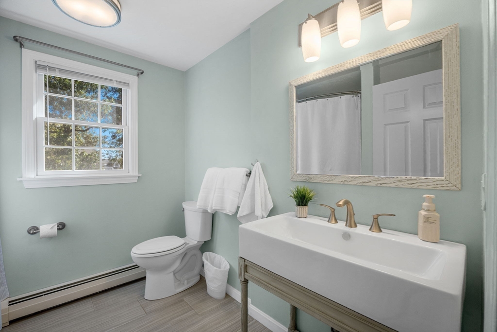 23 Zylpha Road Harwich, MA 02646 - Photo 24 of 39 a bathroom with a sink a toilet and a window