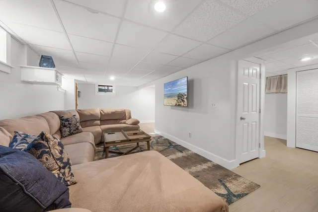 a living room with a couch and a window