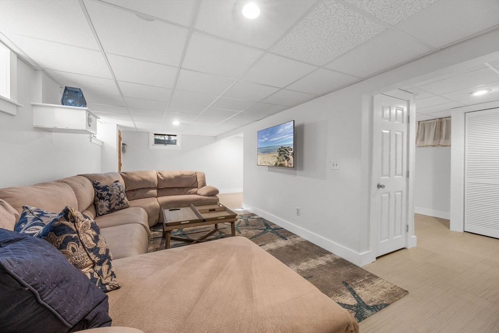 23 Zylpha Road Harwich, MA 02646 - Photo 29 of 39 a living room with a couch and a window