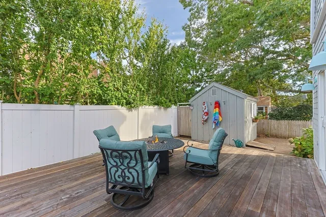 a front view of a house with a yard and a fence