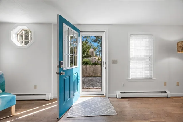a view of a hallway with windows and stairs
