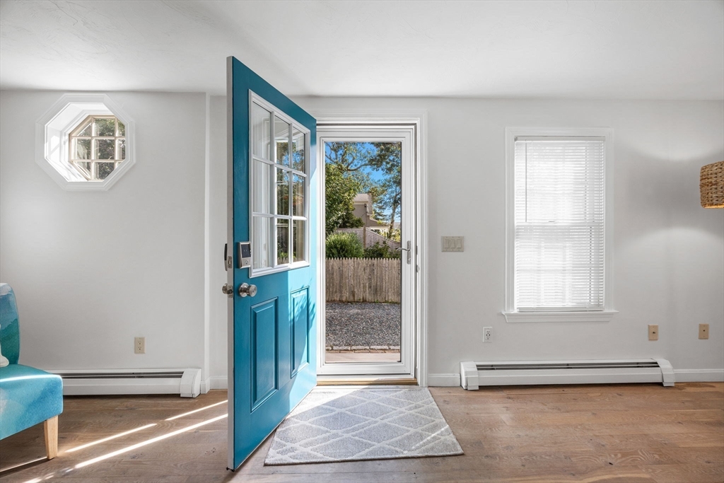 23 Zylpha Road Harwich, MA 02646 - Photo 4 of 39 a view of a hallway with windows and stairs