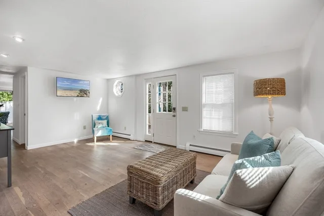 a living room with furniture and window