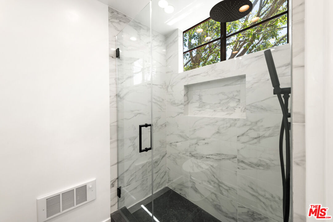 29233 Heathercliff Road, Unit 4 Malibu, CA 90265 - Photo 15 of 20 a bathroom with a shower