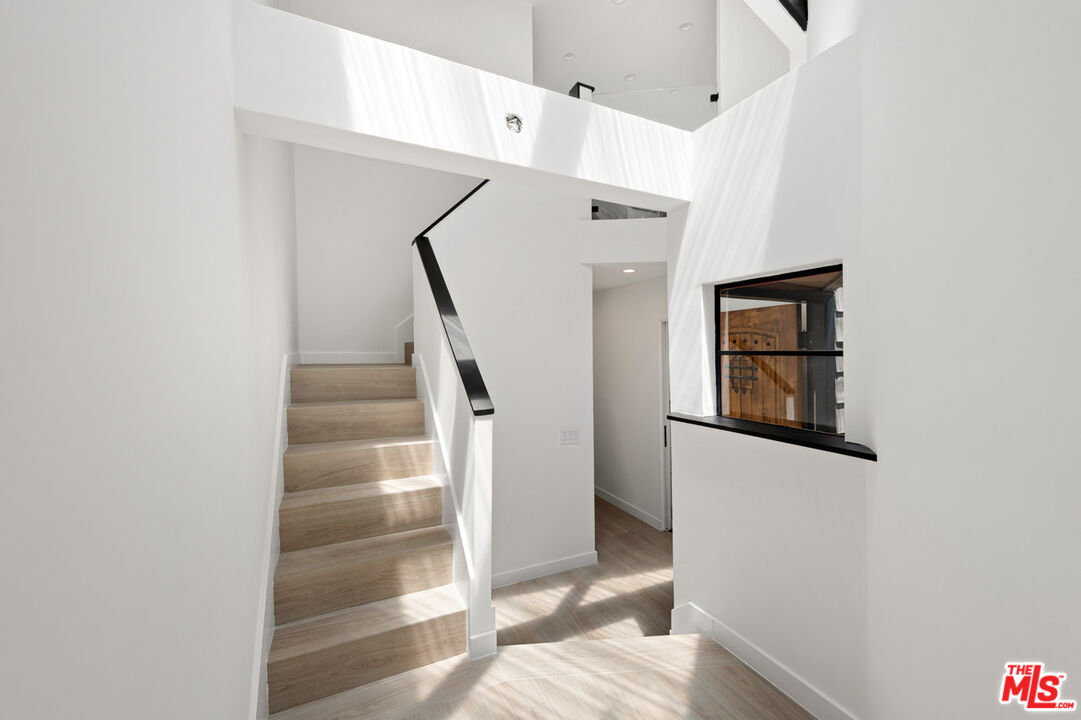 29233 Heathercliff Road, Unit 4 Malibu, CA 90265 - Photo 10 of 20 a view of a hallway with white walls and entryway