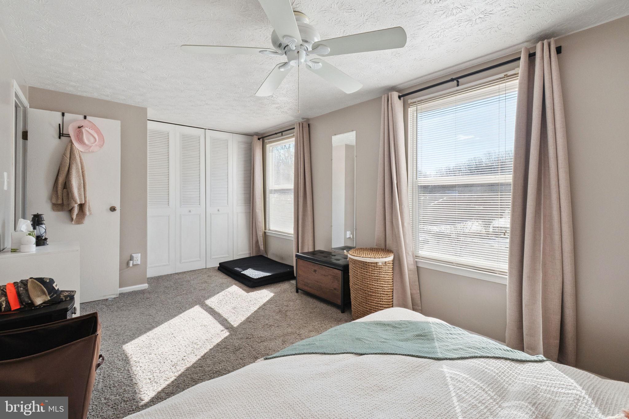 15057 Mill Spring Drive Dumfries, VA 22025 - Photo 11 of 21 a bedroom with a bed and a window