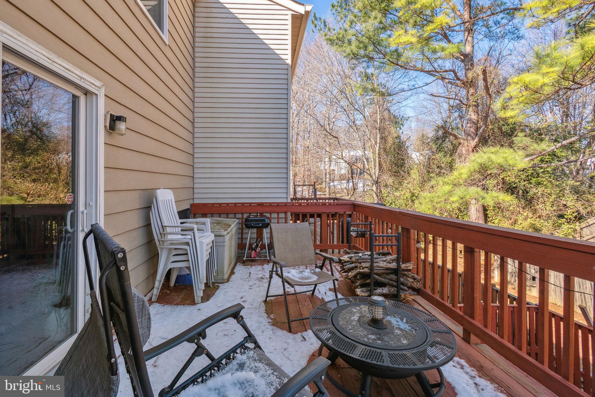 15057 Mill Spring Drive Dumfries, VA 22025 - Photo 20 of 21 a balcony with table and chairs