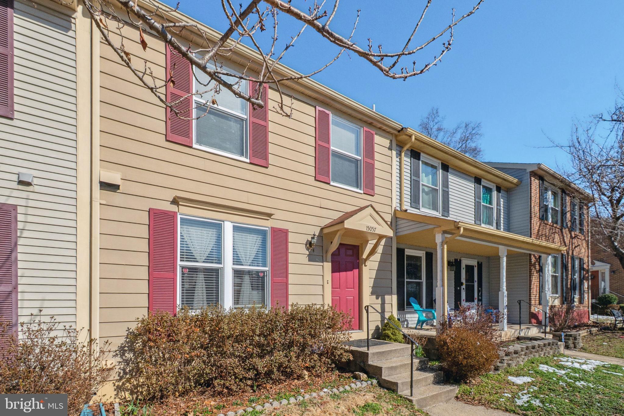 15057 Mill Spring Drive Dumfries, VA 22025 - Photo 2 of 21 a front view of a building with sitting area