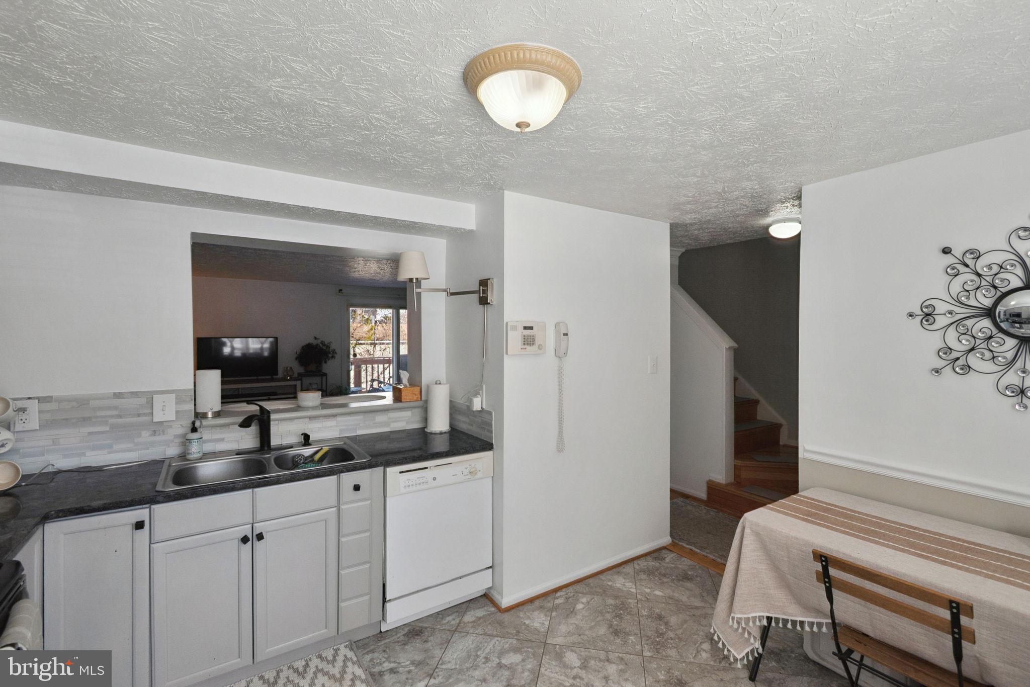 15057 Mill Spring Drive Dumfries, VA 22025 - Photo 5 of 21 a bathroom with a sink and a mirror