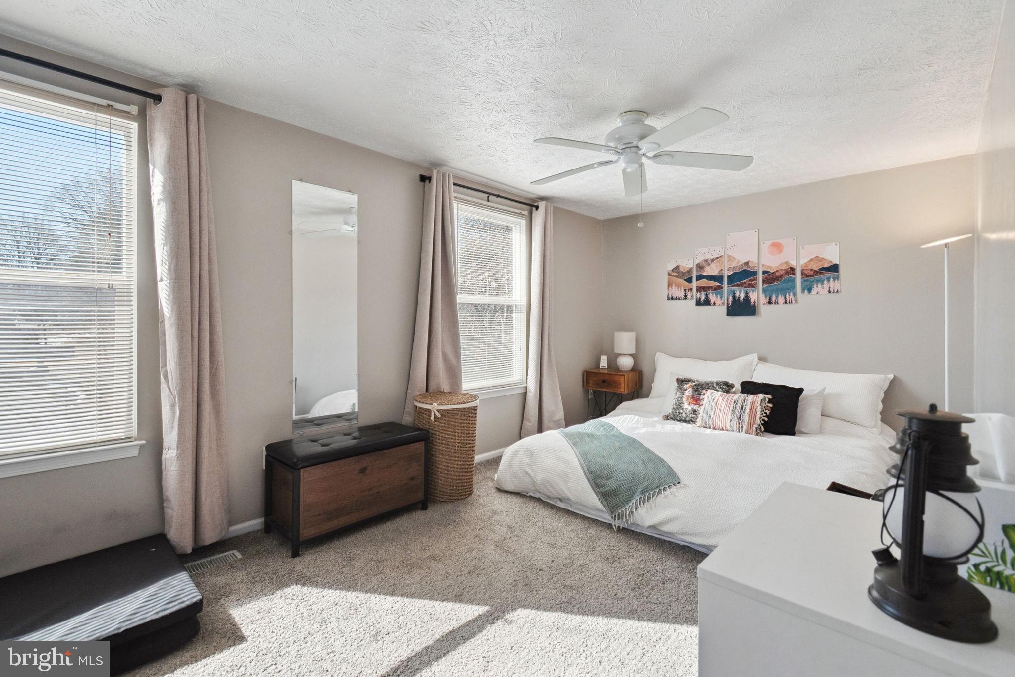 15057 Mill Spring Drive Dumfries, VA 22025 - Photo 10 of 21 a bedroom with a bed and a window