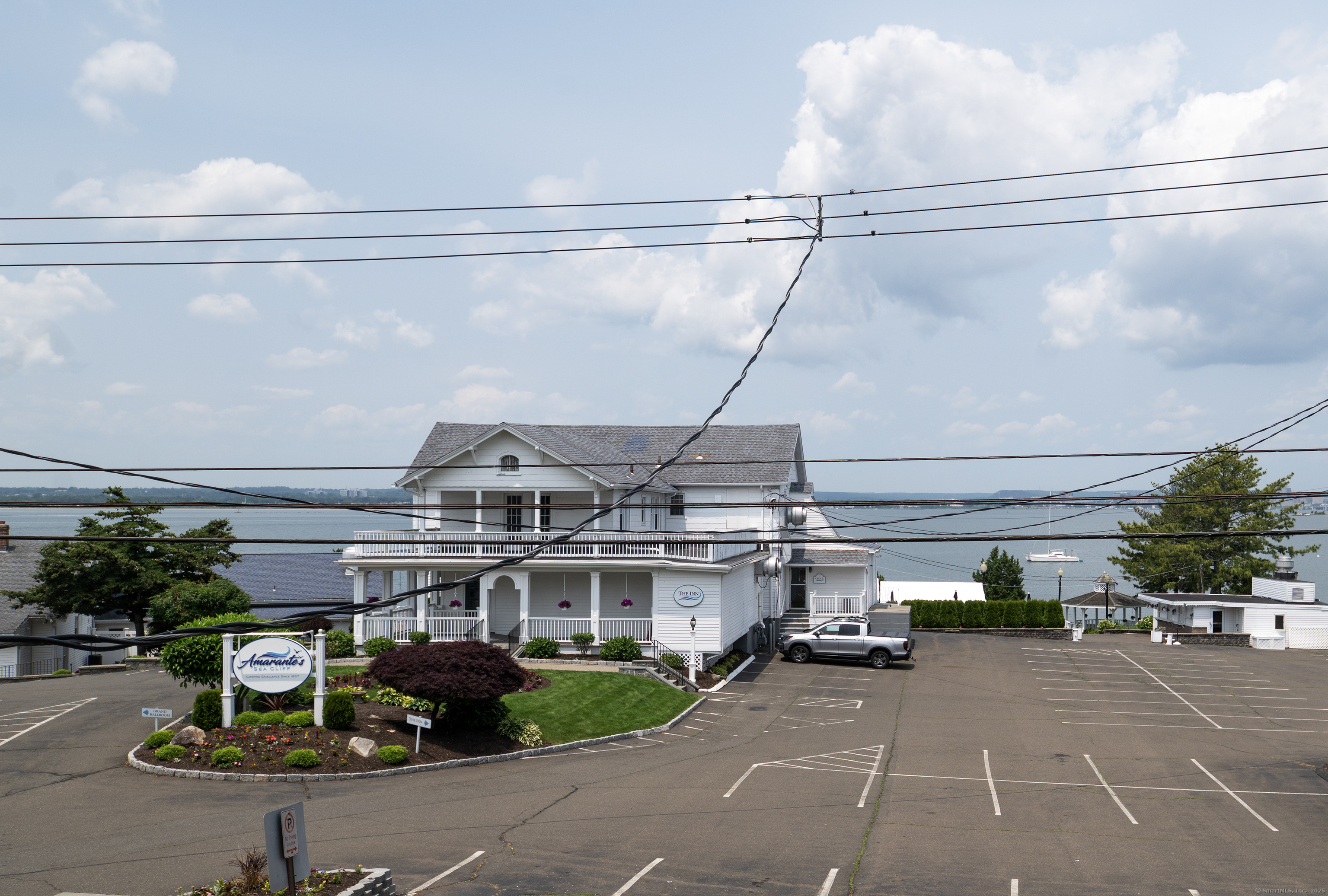 19 Rhea Street New Haven, CT 06512 - Photo 18 of 23 a view of a building with a garden and parking space
