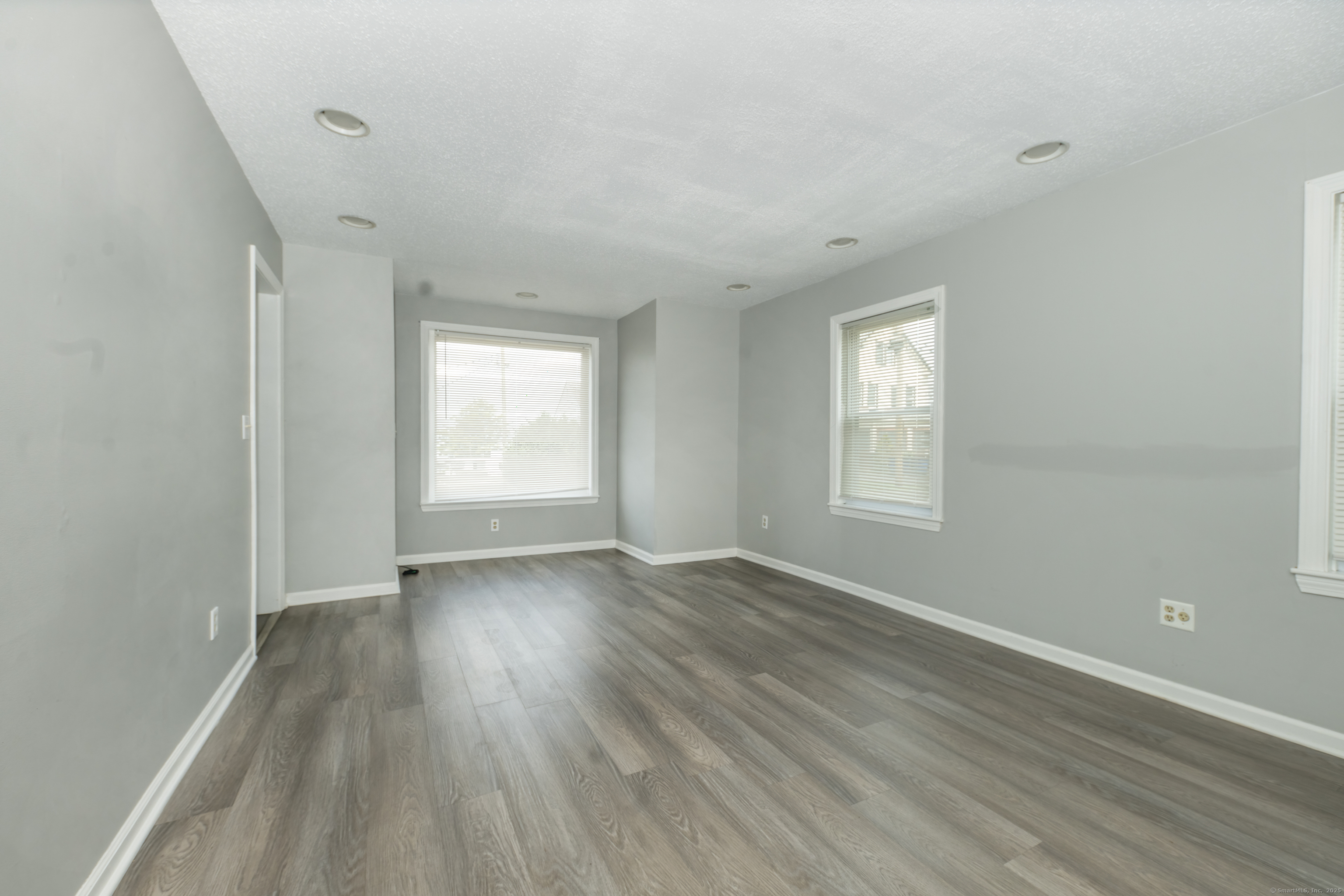 19 Rhea Street New Haven, CT 06512 - Photo 23 of 23 a view of an empty room with wooden floor and window
