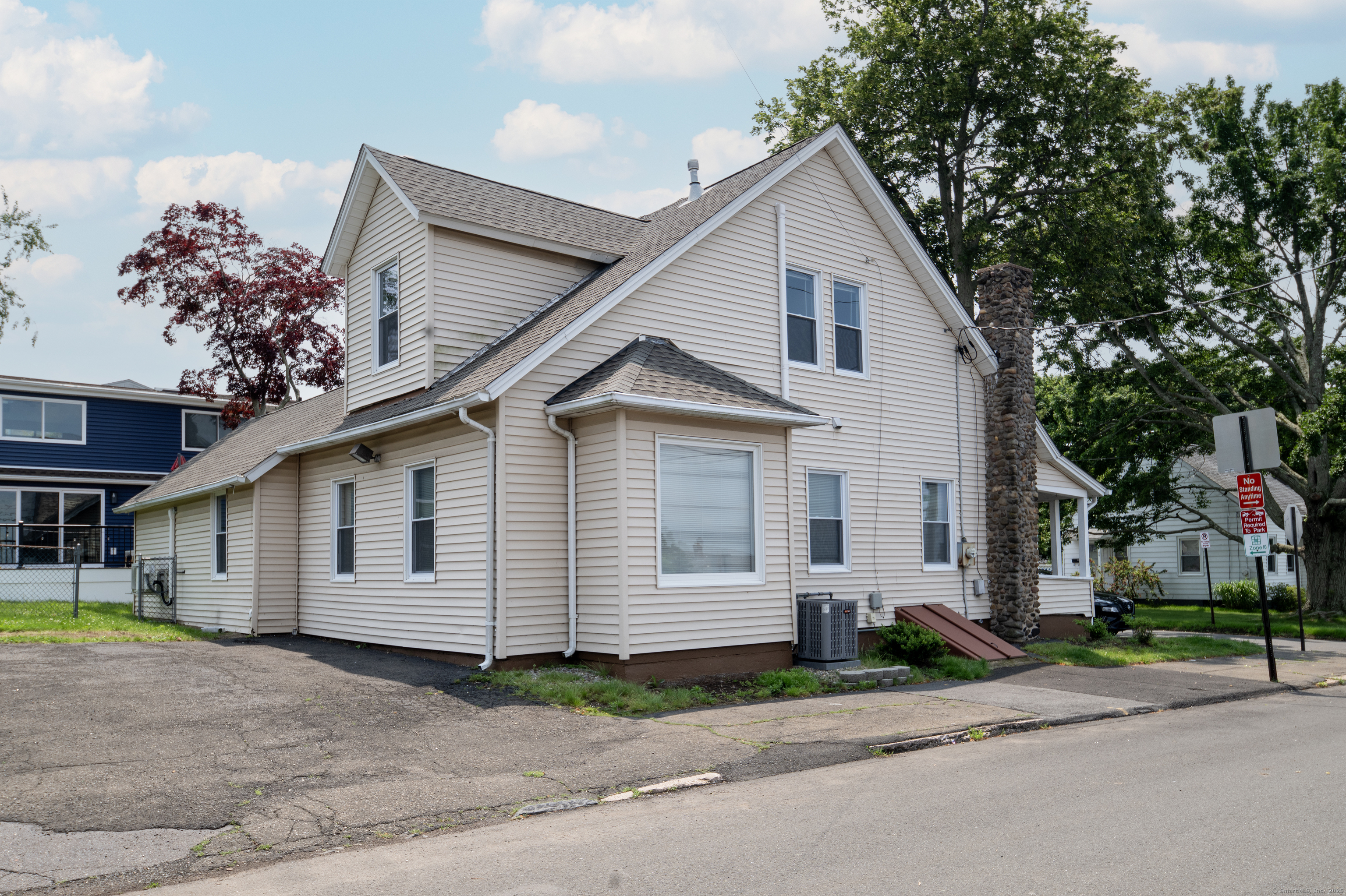 19 Rhea Street New Haven, CT 06512 - Photo 3 of 23 a front view of a house with a yard and garage
