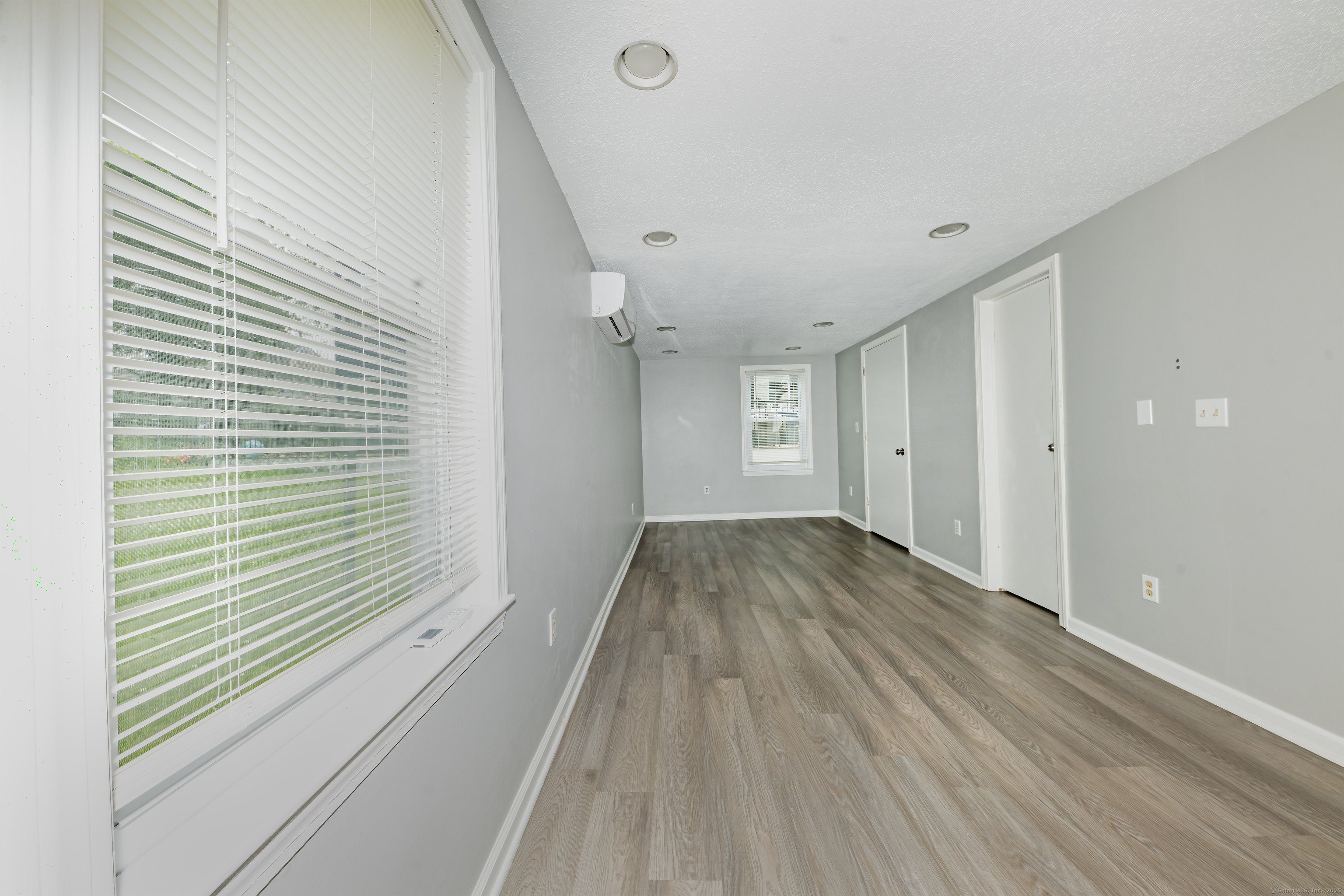 19 Rhea Street New Haven, CT 06512 - Photo 6 of 23 a view of a room with wooden floor and a window