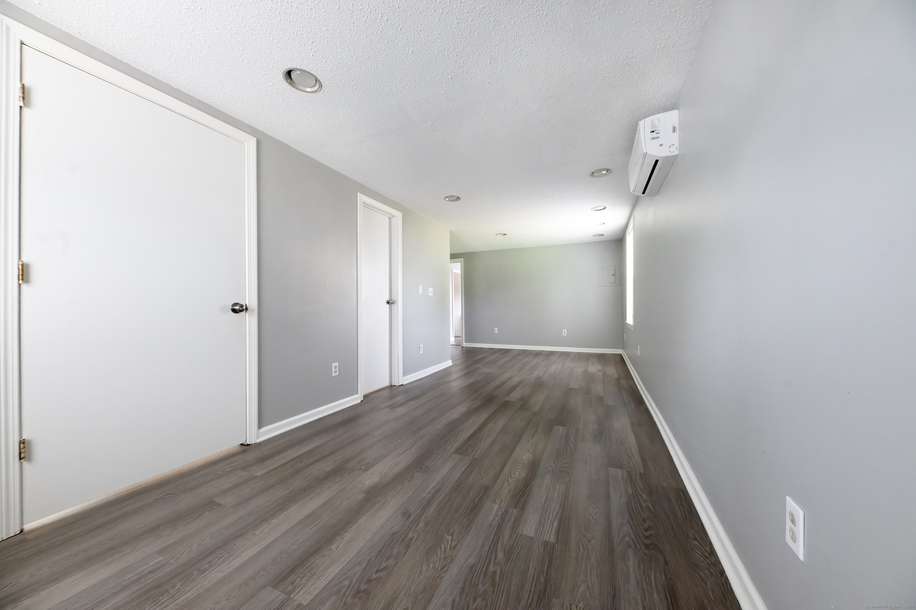 19 Rhea Street New Haven, CT 06512 - Photo 9 of 23 a view of an empty room with wooden floor