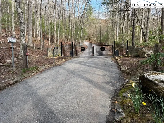 a backyard of a house with barbeque oven and outdoor seating