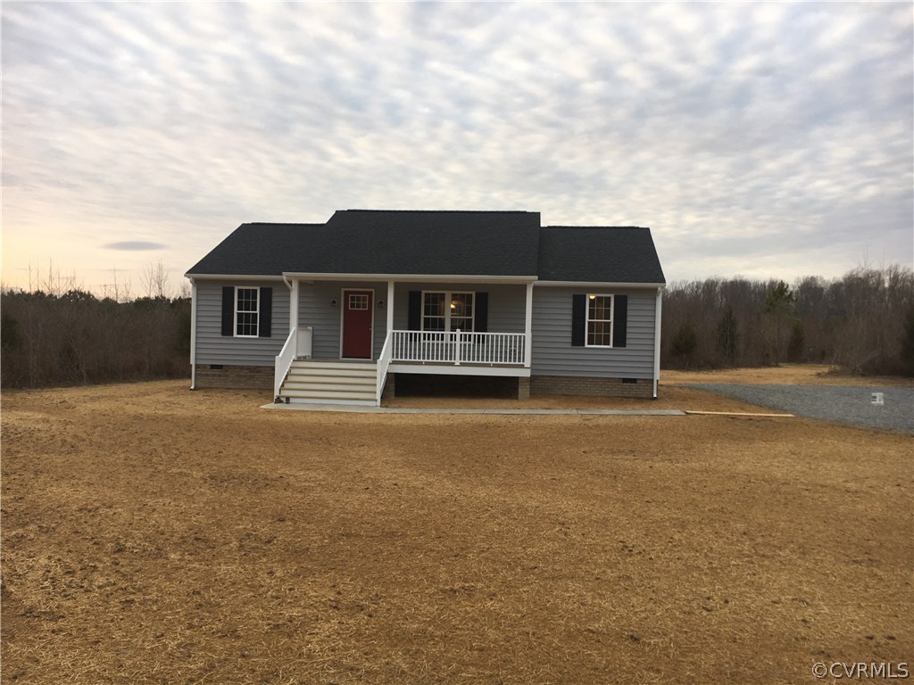 964 East Rose Garden Road West Point, VA 23181 - Photo 1 of 9 a front view of a house with a garden