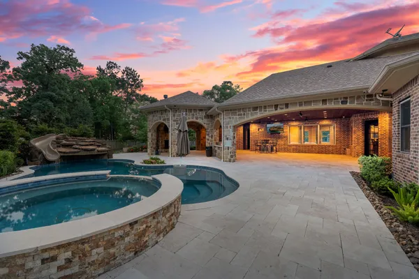 a front view of a house with swimming pool