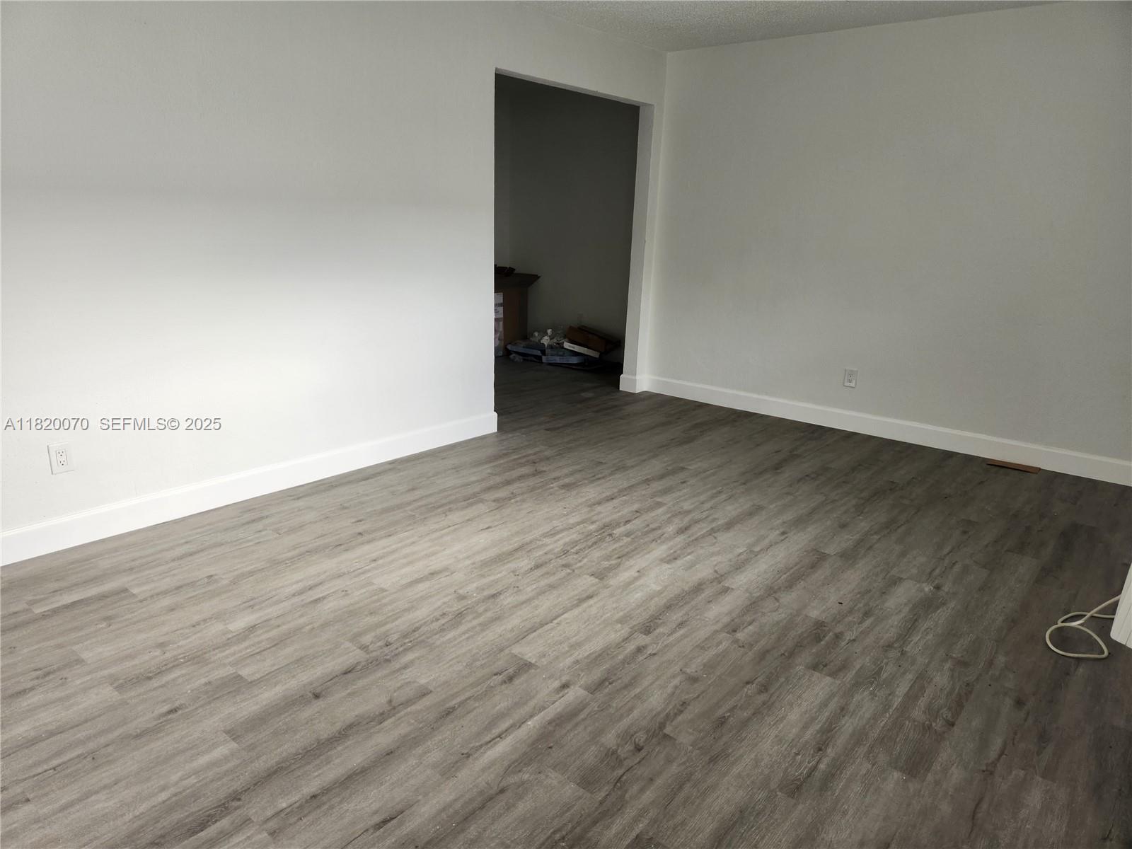 1239 Marseille Drive, Unit 4 Miami Beach, FL 33141 - Photo 15 of 15 wooden floor in a empty room