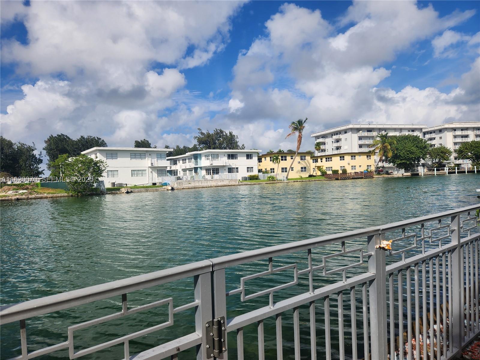 1239 Marseille Drive, Unit 4 Miami Beach, FL 33141 - Photo 3 of 15 a view of a lake from a balcony