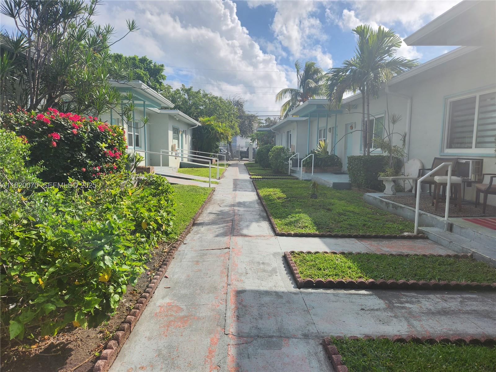 1239 Marseille Drive, Unit 4 Miami Beach, FL 33141 - Photo 5 of 15 a front view of a house with garden