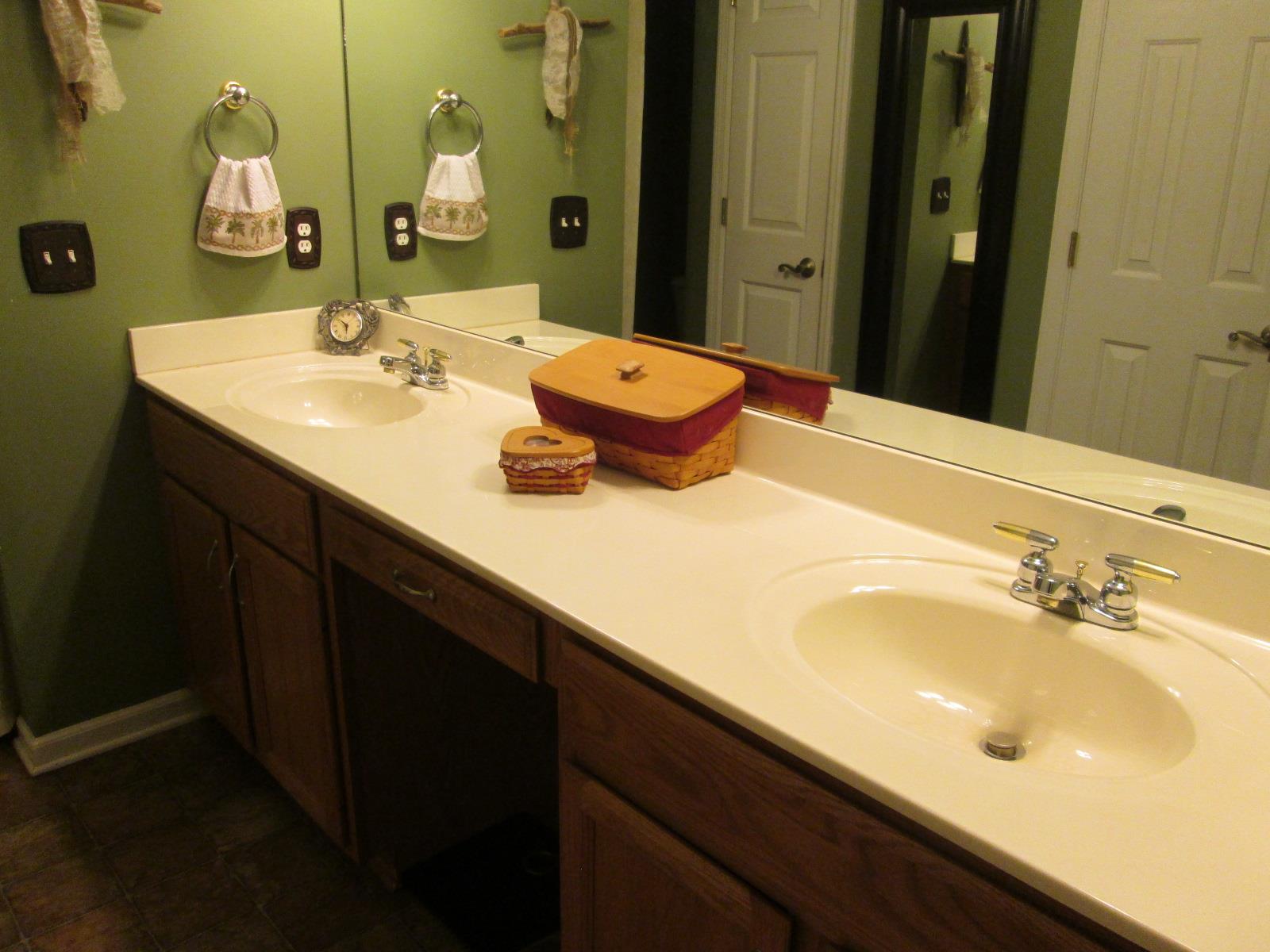 708 3rd Avenue West Springfield, TN 37172 - Photo 13 of 30 a bathroom with a double vanity sink and a mirror