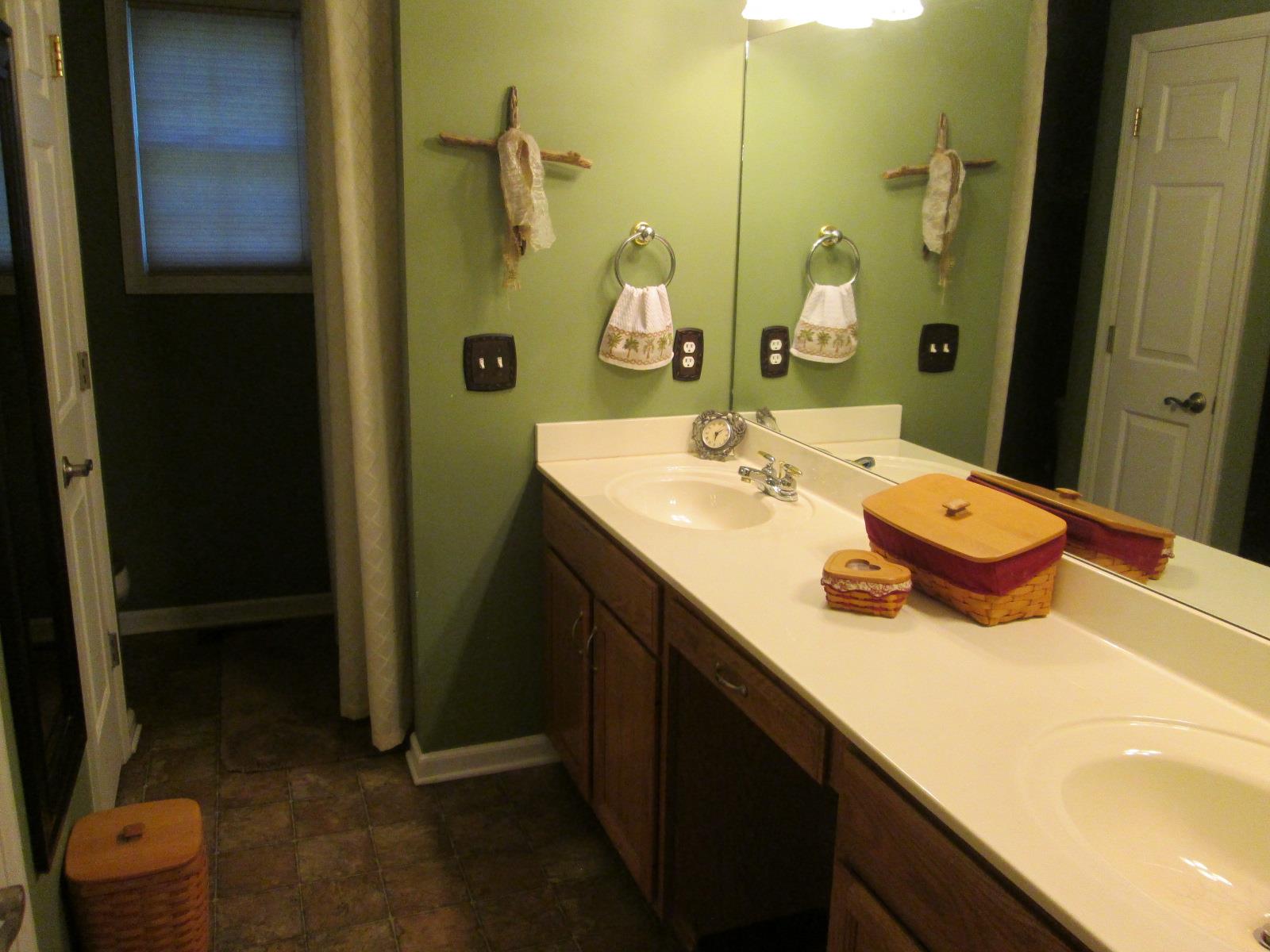 708 3rd Avenue West Springfield, TN 37172 - Photo 14 of 30 a bathroom with a sink double vanity and a mirror