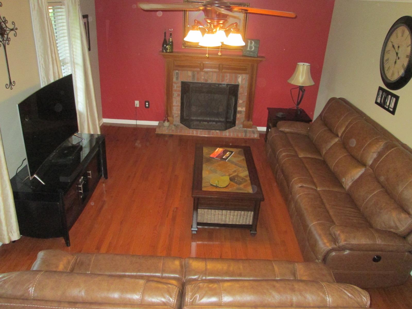 708 3rd Avenue West Springfield, TN 37172 - Photo 2 of 30 a living room with furniture and a fireplace
