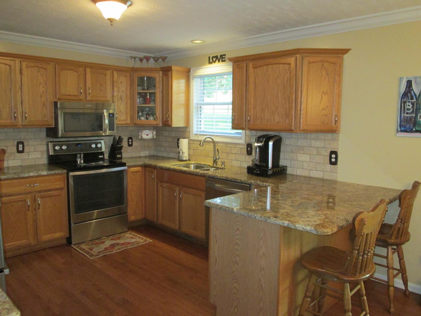 708 3rd Avenue West Springfield, TN 37172 - Photo 7 of 30 a kitchen with a sink stove top oven and microwave