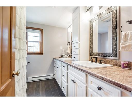 75 Argilla Road Andover, MA 01810 - Photo 23 of 30 a bathroom with a granite countertop sink mirror and a bathtub