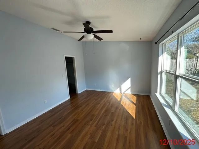 a kitchen with stainless steel appliances granite countertop a refrigerator a stove a microwave and island