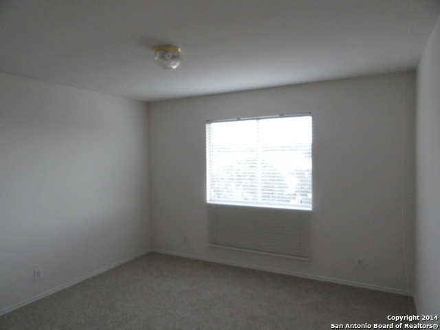 8026 Rio NIEBLA San Antonio, TX 78249 - Photo 14 of 15 an empty room with a window