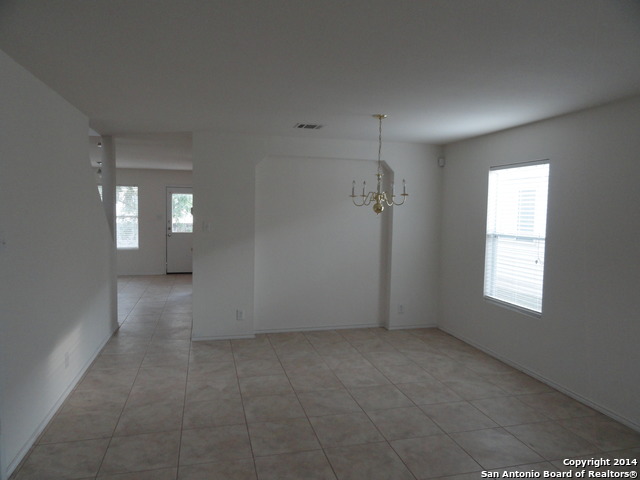 8026 Rio NIEBLA San Antonio, TX 78249 - Photo 3 of 15 an empty room with windows