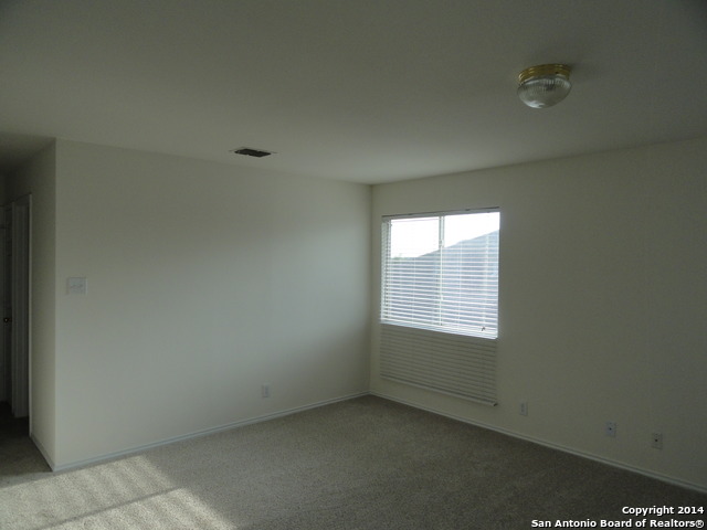 8026 Rio NIEBLA San Antonio, TX 78249 - Photo 8 of 15 a view of an empty room with a window