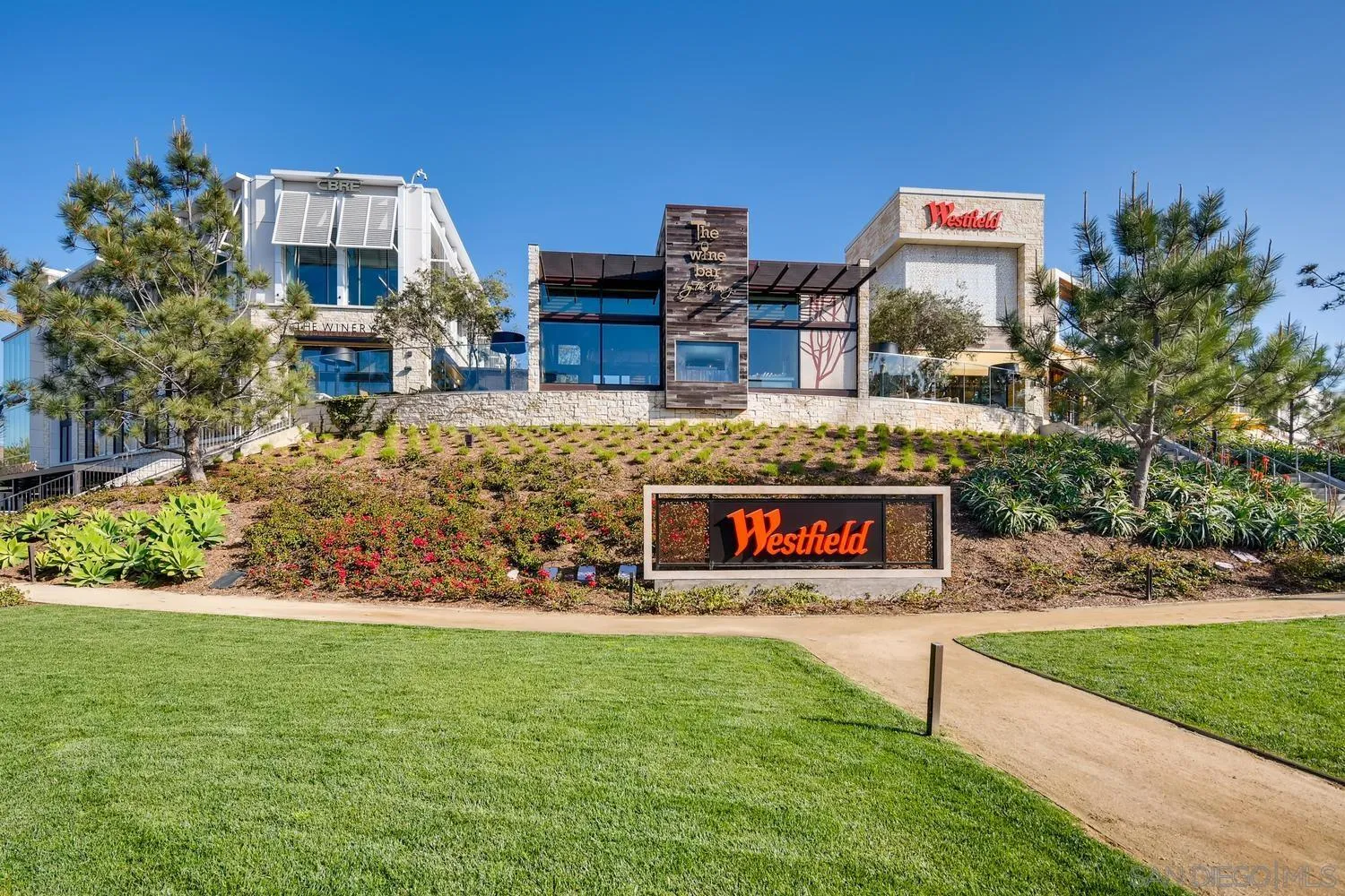 8308 Regents Road, Unit 1H San Diego, CA 92122 - Photo 11 of 23 a sign board with tall buildings in the background