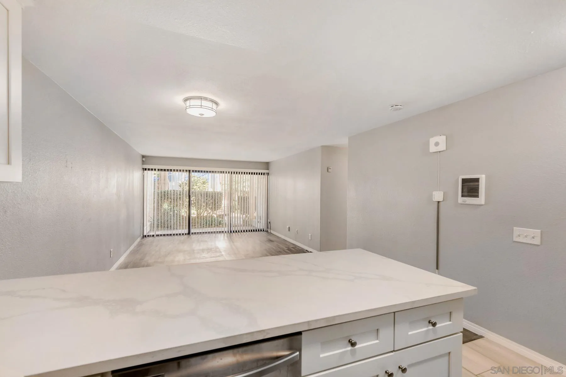 8308 Regents Road, Unit 1H San Diego, CA 92122 - Photo 12 of 23 a bedroom with a bed and a window