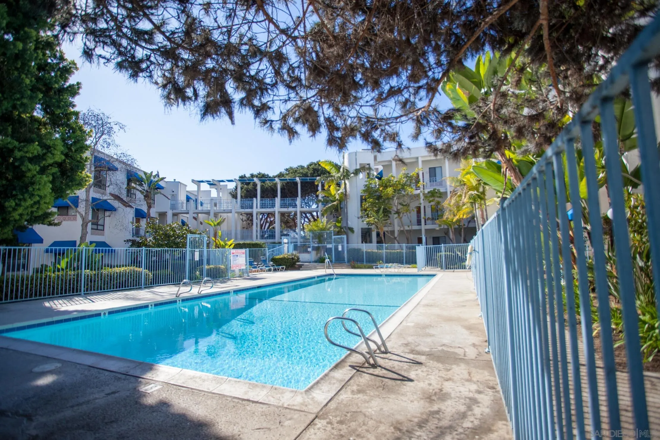 8308 Regents Road, Unit 1H San Diego, CA 92122 - Photo 13 of 23 a view of a swimming pool with a patio