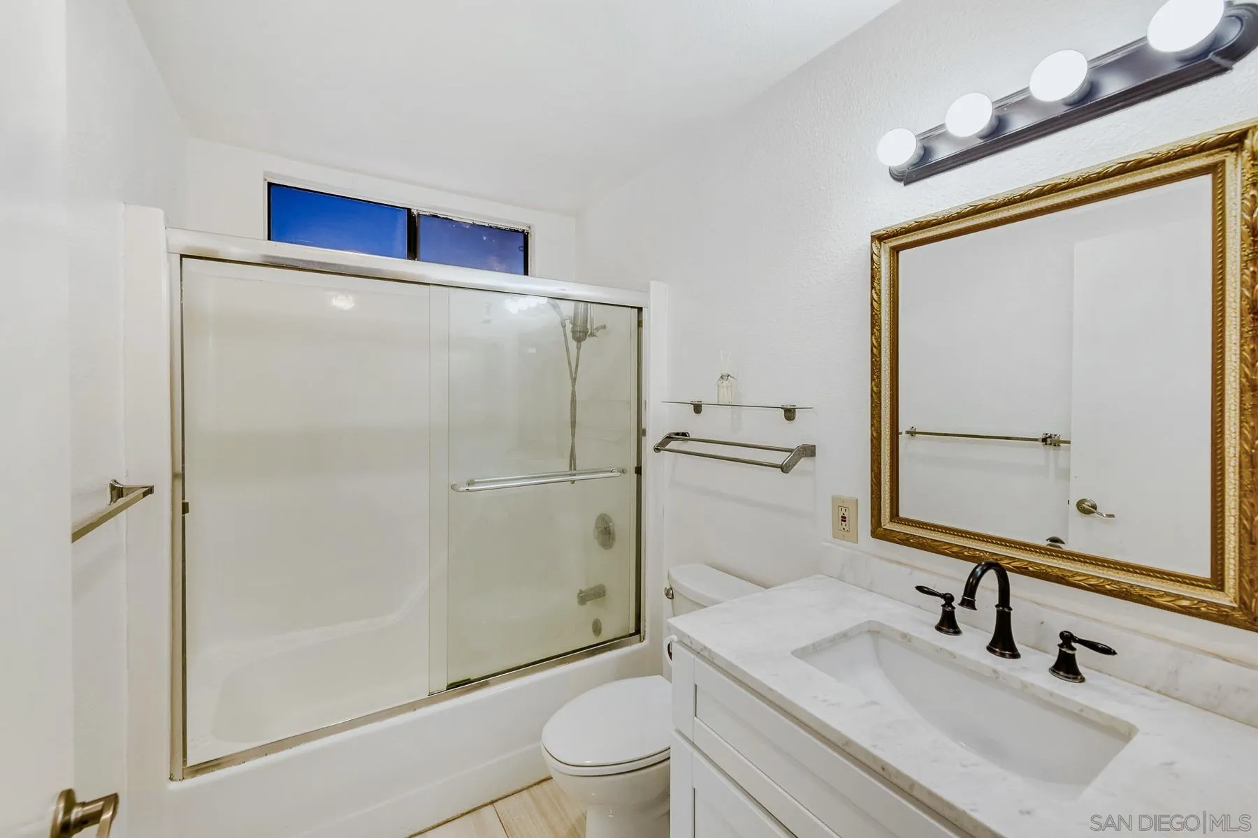 8308 Regents Road, Unit 1H San Diego, CA 92122 - Photo 19 of 23 a bathroom with a sink toilet and shower