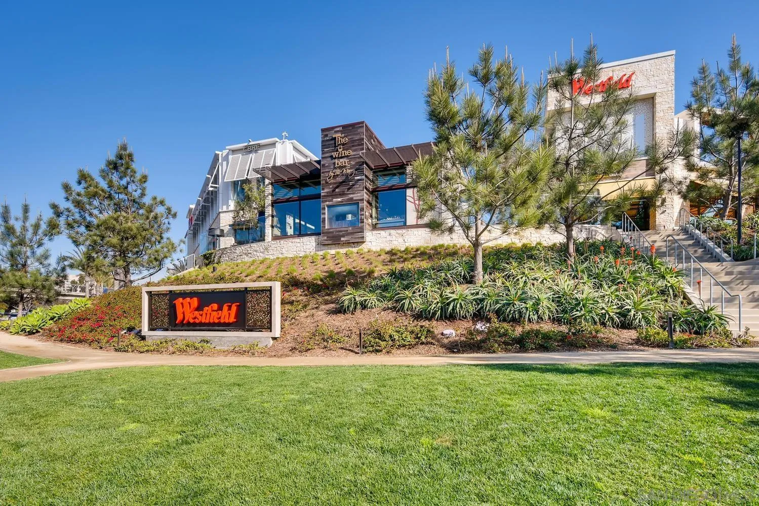 8308 Regents Road, Unit 1H San Diego, CA 92122 - Photo 20 of 23 a front view of a house with a yard