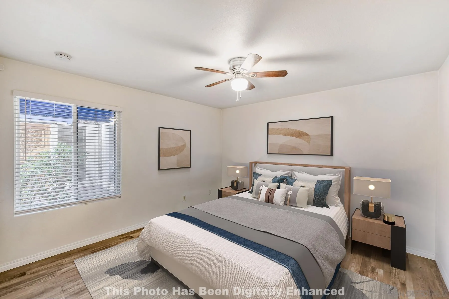 8308 Regents Road, Unit 1H San Diego, CA 92122 - Photo 5 of 23 a bedroom with a large bed and a window