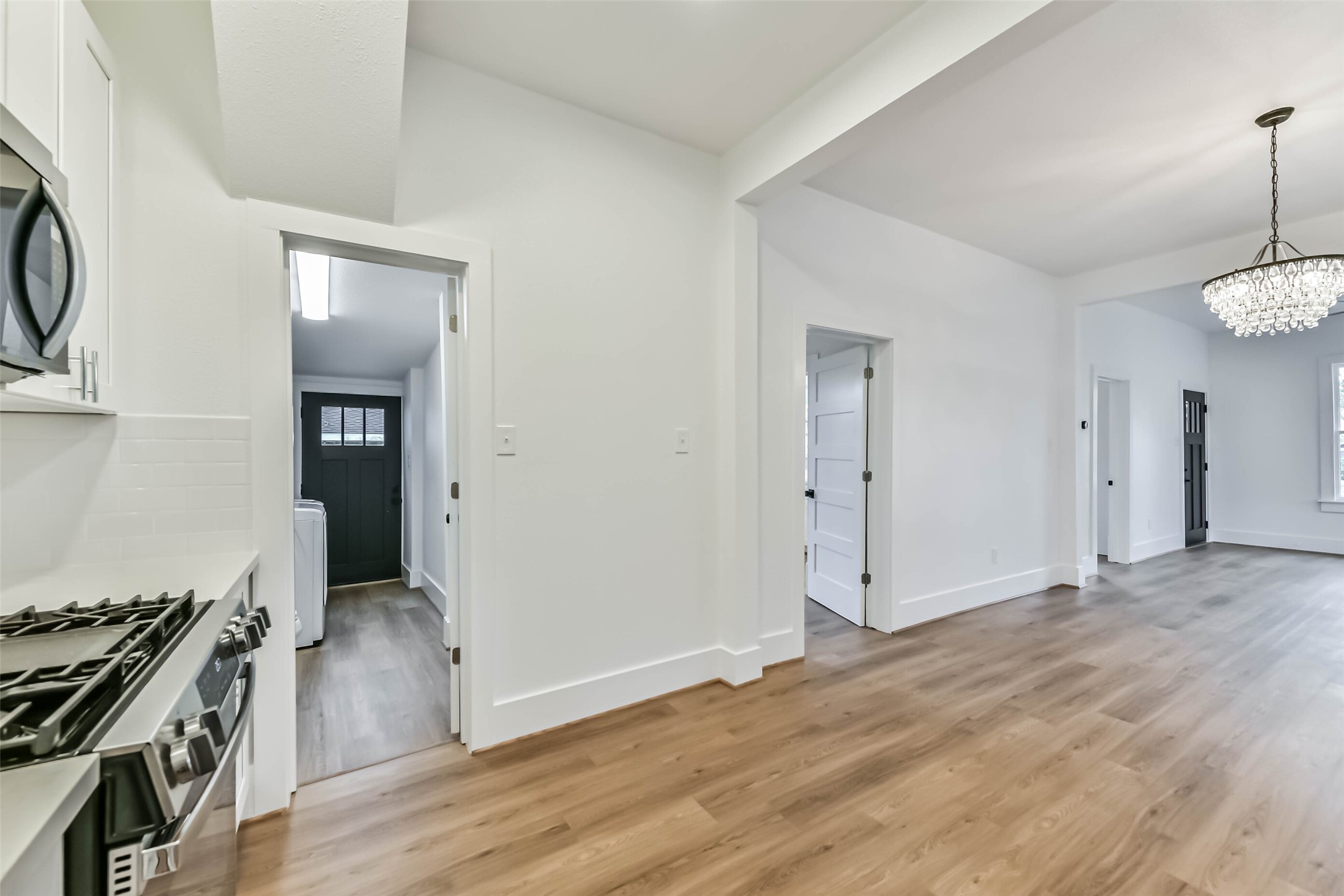 1616 38th Street Galveston, TX 77550 - Photo 15 of 26 an empty room with wooden floor and bathroom