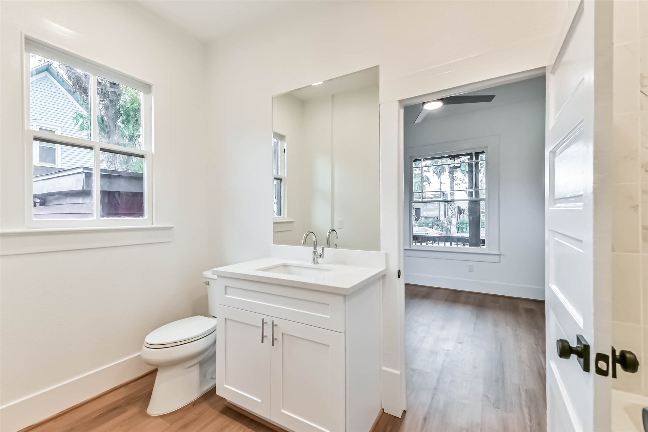 1616 38th Street Galveston, TX 77550 - Photo 20 of 26 a bathroom with a toilet sink and a window